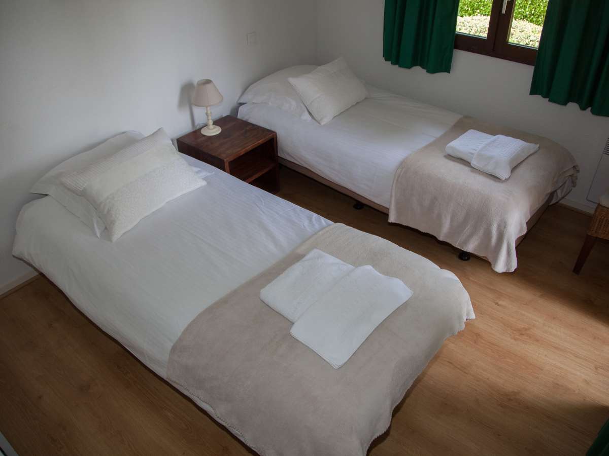 cama doble en habitación privada de Huacachina